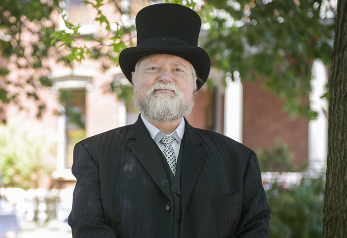 Photograph of Harrison reenactor, posing in front of the mansion.