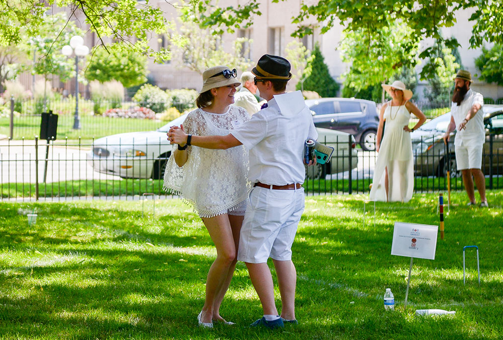 Photograph of people dancing on the lawn of the Presidential Site.