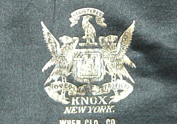 imprinted in gold inside on the top is ‘Extra Quality centered over a mark/symbol – the word Registered on banner over a bird with wings next to body, which is over a shield with a bird on each side with wings extended sitting on a banner/ribbon with the words Moveo et Proficio printed; the word KNOX is under the banner; New York on the line beneath; under the shield on two lines is ‘When Col. Co. Indianapolis.’