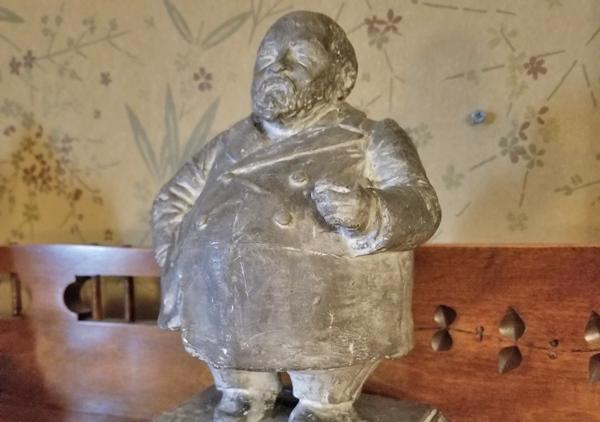 Plaster statue of Benjamin Harrison. Caricature of Benjamin Harrison made by Frank Allen Jr. circa 1895 - 1900. White plaster with a light gray paint coating. On back of base 