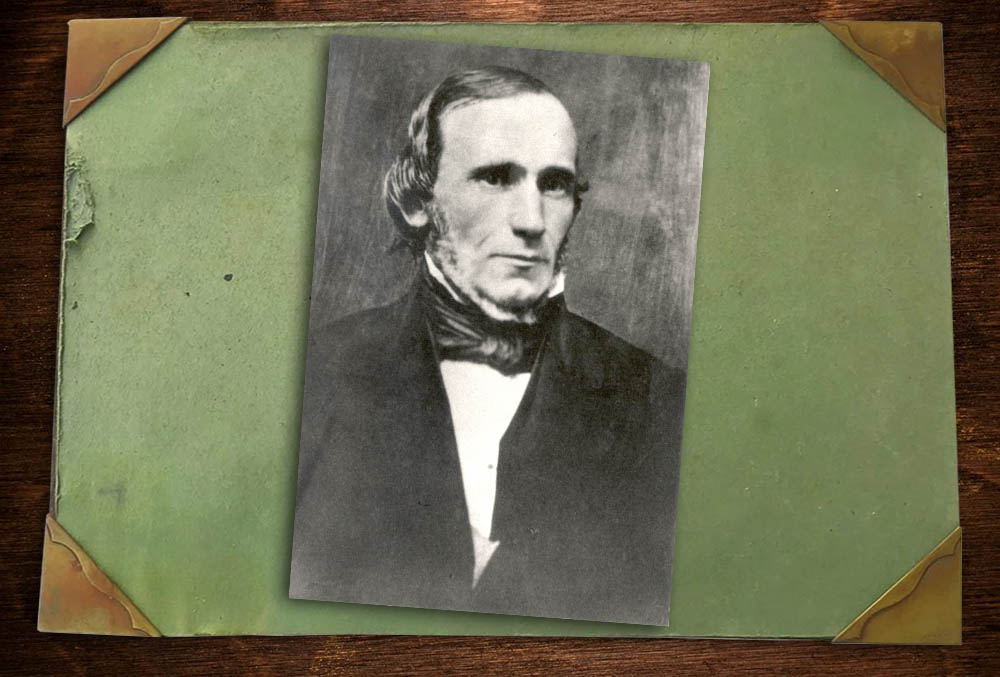 Photo of John Scott Harrison on a desktop blotter.