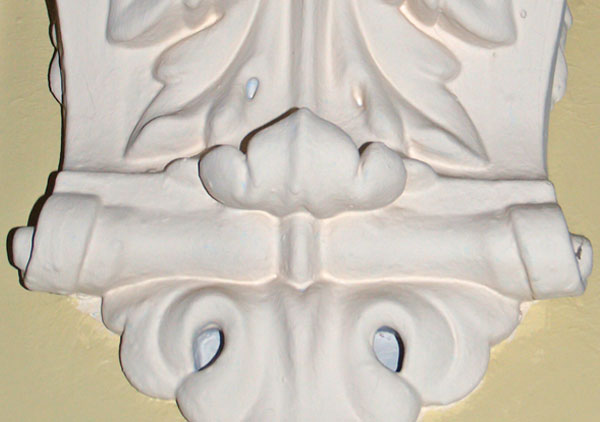 Decorative molding made of plaster that is in several of the hallways of the house. The molding is in archways on the first and second floors in the main halls.